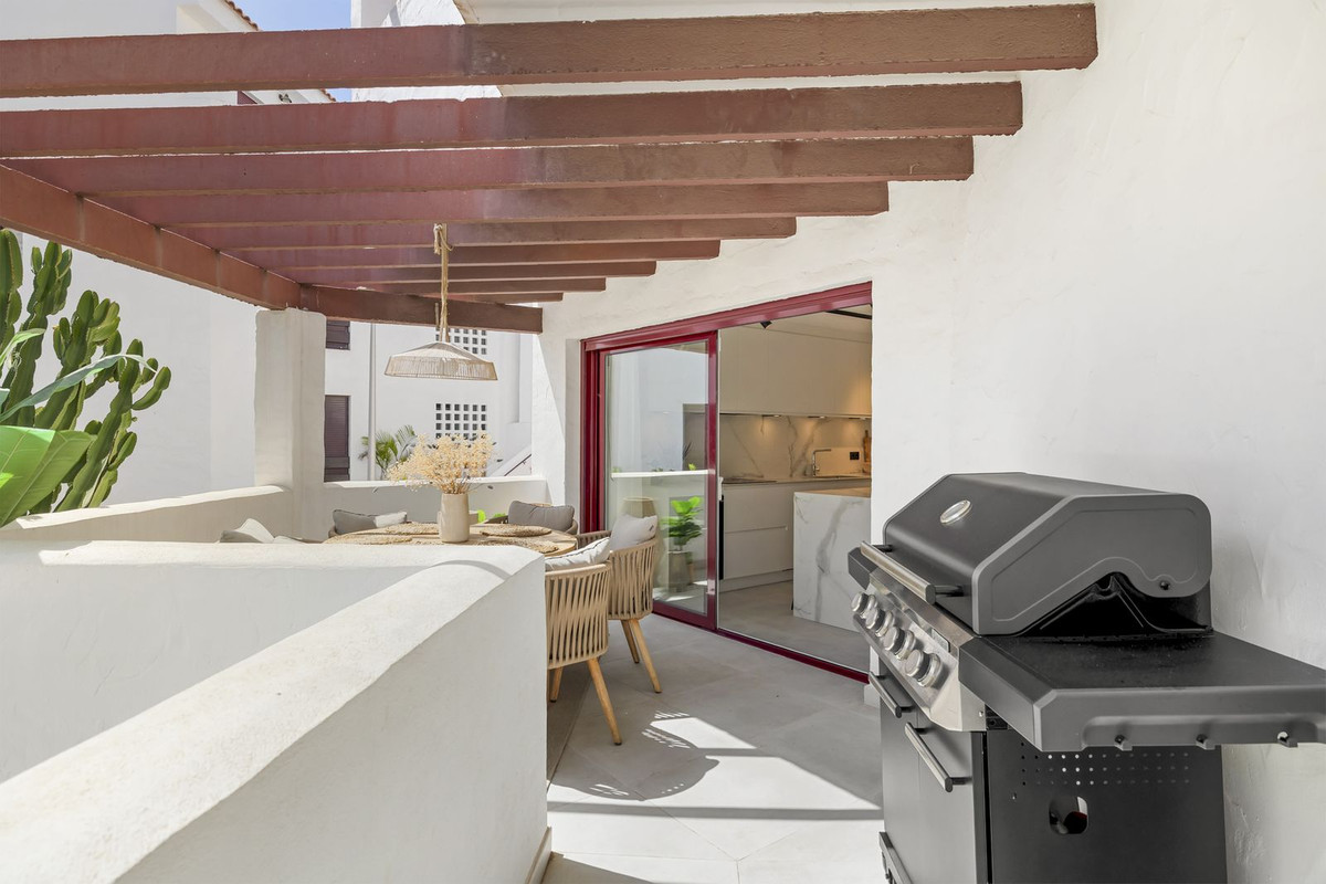 Terrace with built-in barbecue beside the kitchen doors