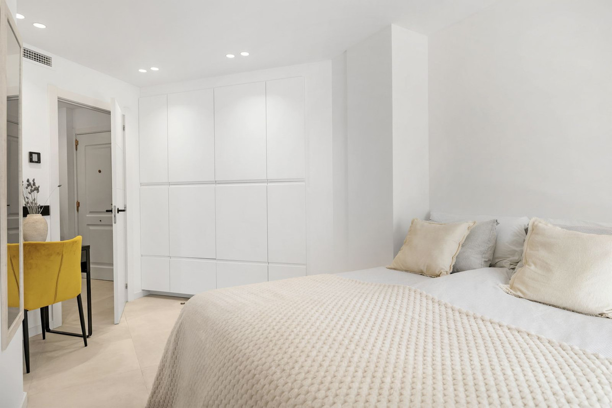 Bedroom with full-height fitted wardrobes