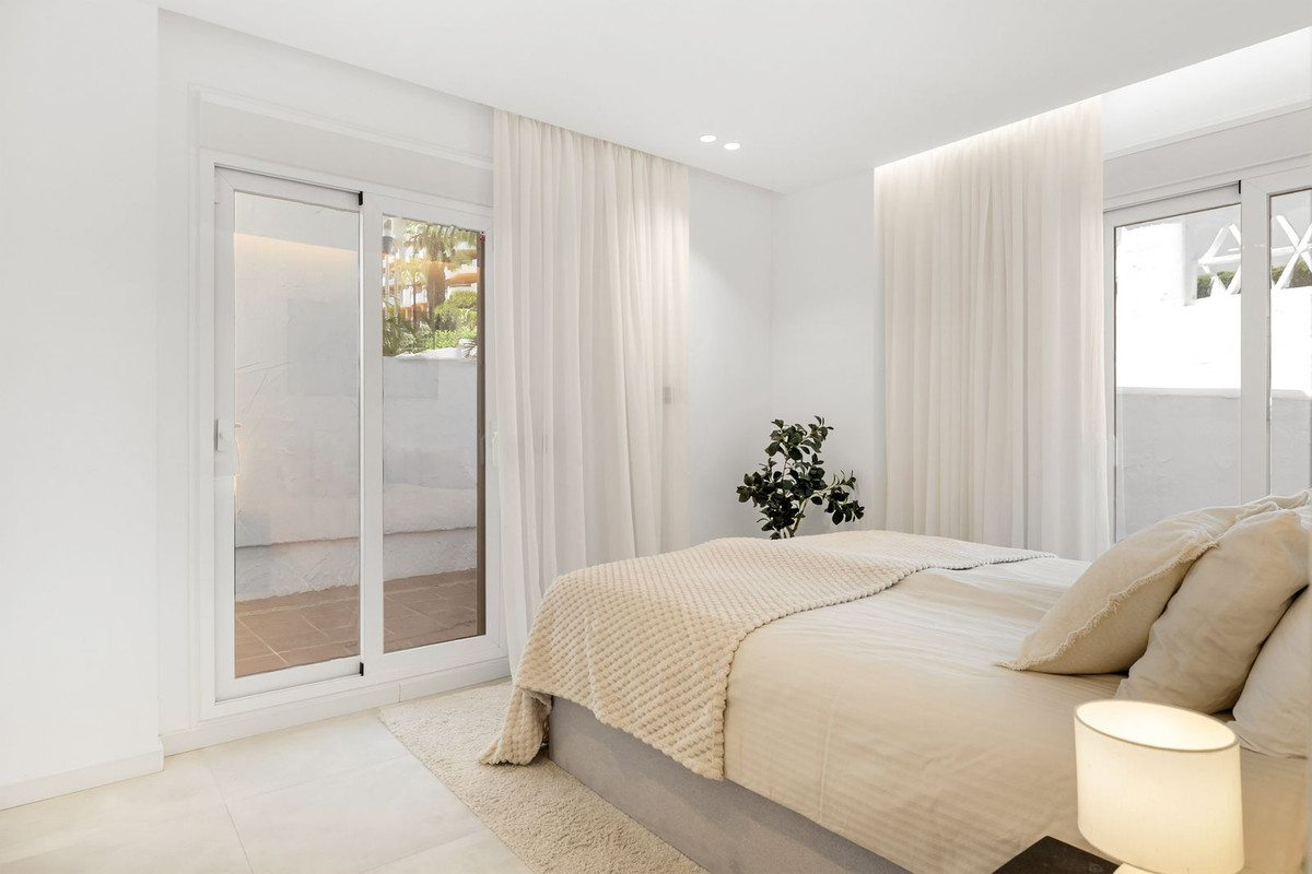 Bedroom with sliding doors to a private patio